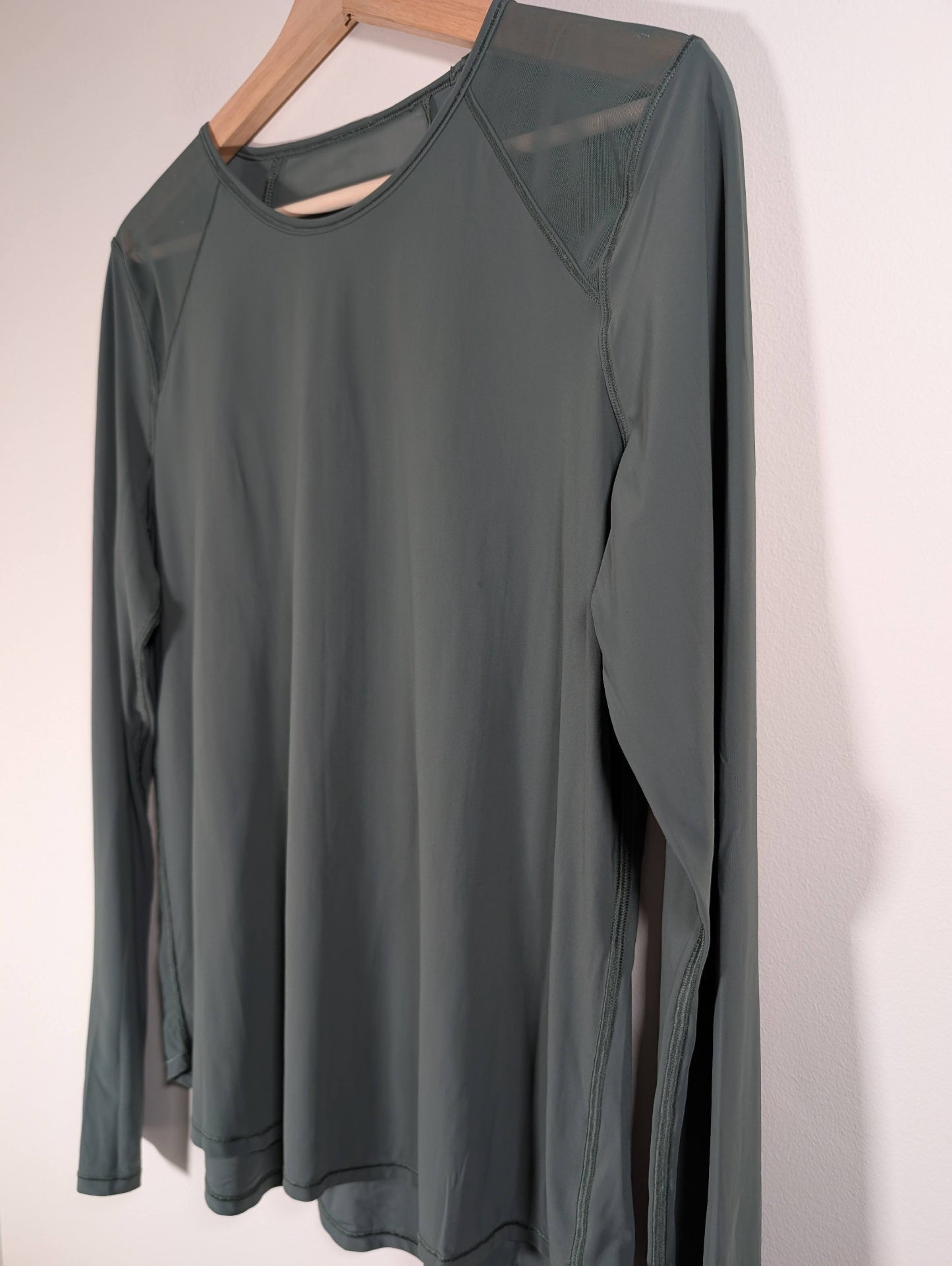 Lululemon green long-sleeve - appears 8/10